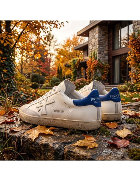Premiata Steven Pure Edición nueva puntera y contraste talonera azul vista lateral sobre hojas