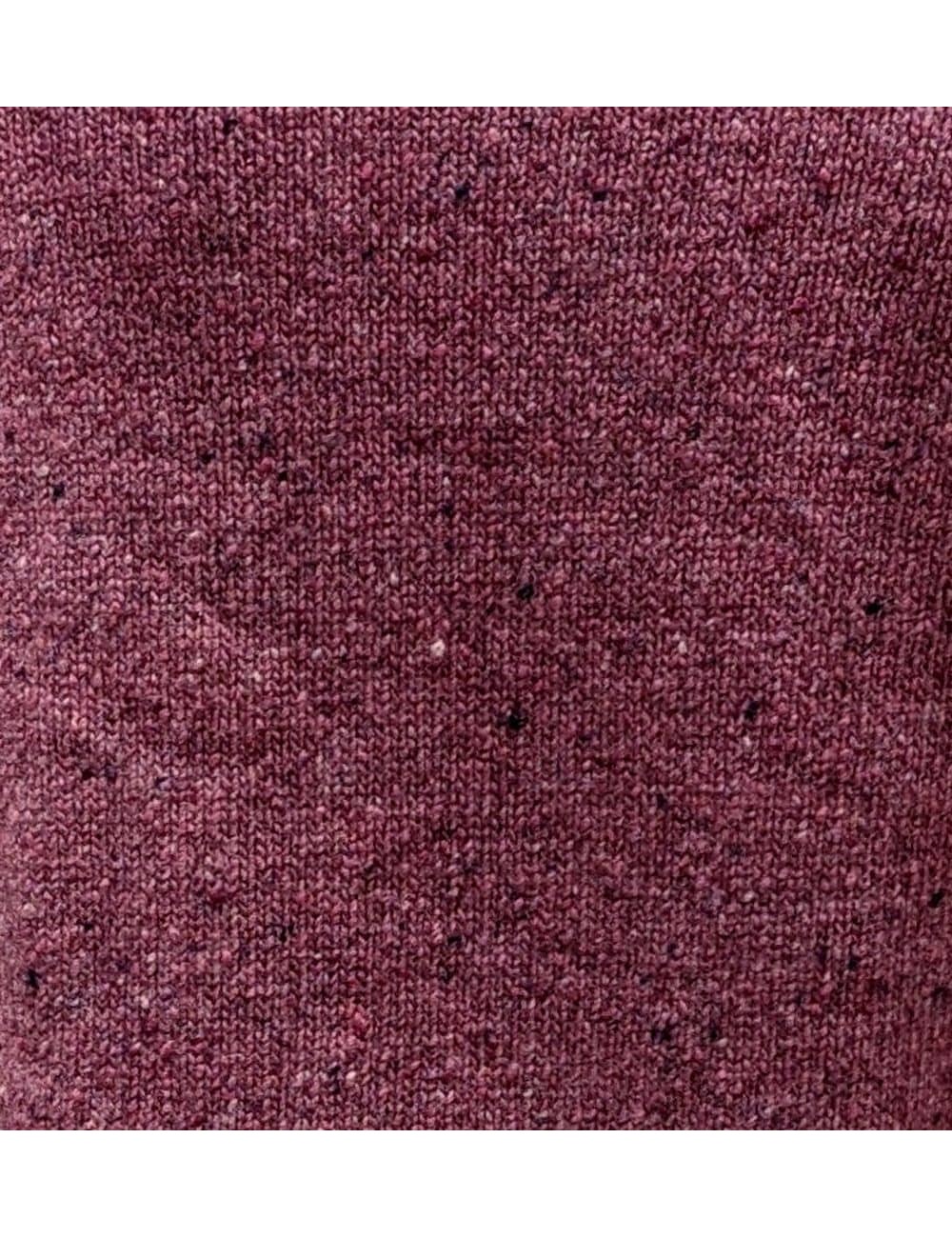 Sueter confeccionado en lana y cashemere, jaspeado,  color brillante e intenso.
